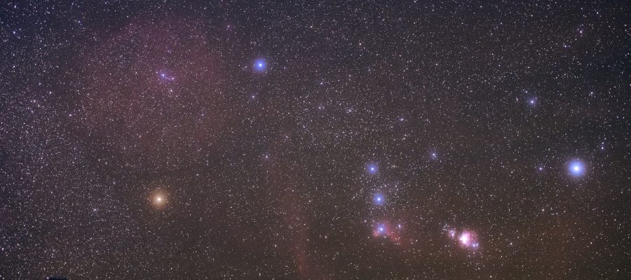 Constellation Orion with its vast nebulosity rises in the sky.