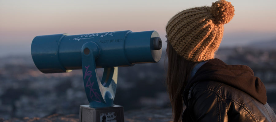 Image of Girl looking through binoculars